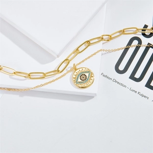 Gold double-layered evil eye pendant necklace with a stylish paperclip chain design