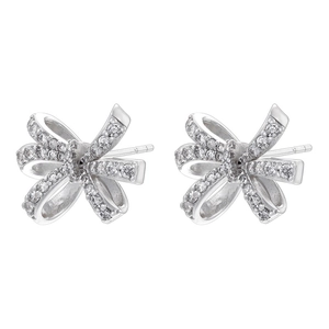 Detailed view of silver bow earrings with micro-paved cubic zirconia in ribbon design