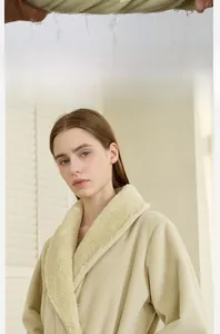 Detailed view of the thick plush coral fleece fabric and double-layered large shawl collar