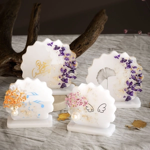 Artistic resin coasters with wave edges, floral elements and gold foil for home decor