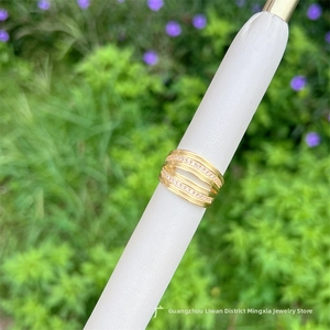Detailed view of layered 18K gold plated ring with micro-pave white zircon stones