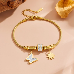 Bracelet en acier inoxydable doré avec breloques papillon, fleurs et strass étincelants
