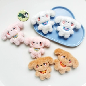 Detailed view of six colorful plush puppy dolls in white, pink, and brown soft fabric
