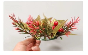 Detailed side view of Christmas candle ring with red berries and golden leaves