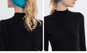 Detail of the mock neck design and fine ribbed texture on this black knit top