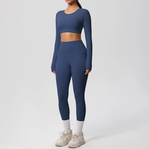 Detailed view of long sleeve crop top and high-waisted yoga leggings with side pocket