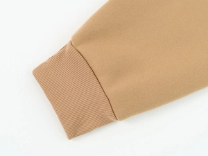 Detailed macro view of khaki men hoodie featuring elastic ribbed cuffs and knit texture
