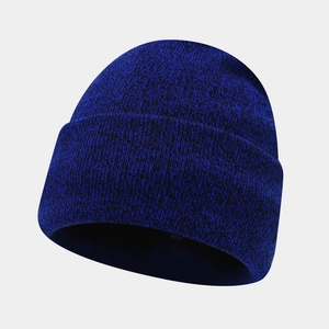 Detail of navy blue knit beanie with thick ribbed texture for winter warmth