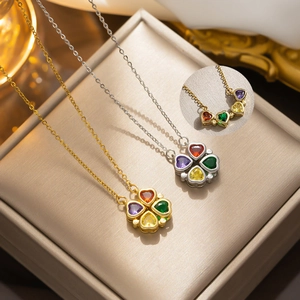 Detailed view of titanium steel clover necklace with four heart-shaped colored gemstones