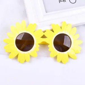 Funny sunflower shaped party sunglasses with yellow petals and dark lenses for kids