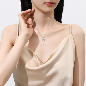 Elegant S925 silver necklace with sea blue square zircon pendant on model neck