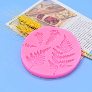 Pink silicone mimosa and fern leaf fondant mold for tropical forest cake decorating