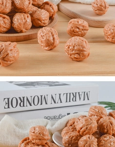 Realistic PVC walnuts with detailed texture displayed on a wooden tray for home decor