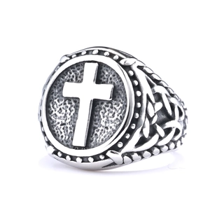 Vintage stainless steel cross ring with Celtic knot patterns on a clean white background