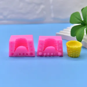 Pink silicone mold for basket shape cake or soap making with finished yellow sample