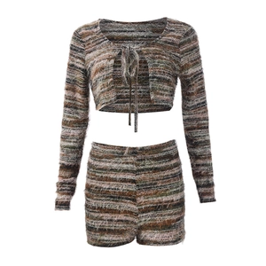 Close-up of fuzzy knit texture and striped pattern on the long sleeve cardigan and shorts