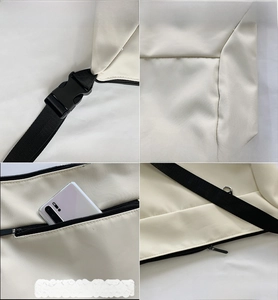 Detail view of beige canvas messenger bag showing adjustable strap and anti-theft zipper pocket