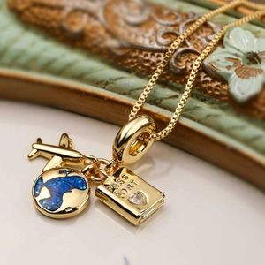 18k gold plated stainless steel travel necklace with airplane, globe and passport charms