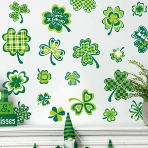St. Patrick's Day shamrock window clings featuring green clover patterns on white wall