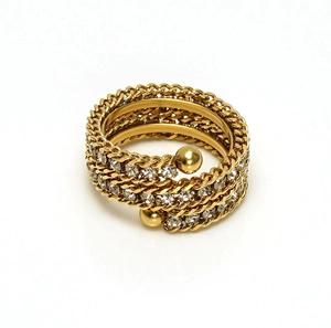 Detailed view of multilayer gold ring with sparkling white rhinestones and chain design