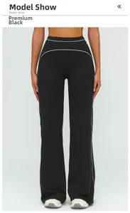 Detail of high waisted flare sweatpants with side stripes in premium black finish
