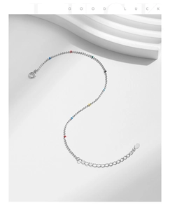 Macro view of S925 sterling silver chain with colorful beads and clear S925 hallmark