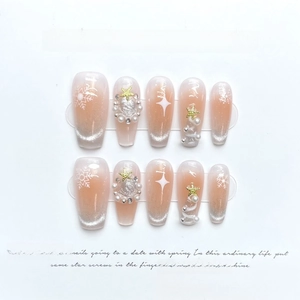 Christmas press-on nails with ice cat eye effect, snowflakes and pearl decorations