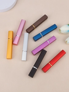 Radial layout of 12ml metallic refillable perfume atomizers in assorted colors and textures