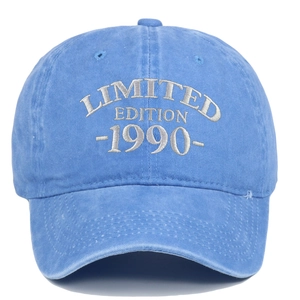 Detail of white LIMITED EDITION 1990 embroidery on washed blue cotton baseball cap