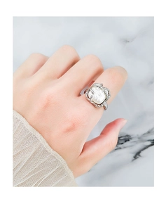 Detailed view of French style S925 silver vine ring with an irregular white pearl inlay
