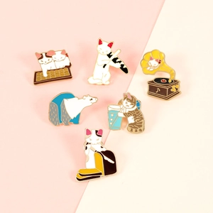 Set of 6 cute cartoon cat and polar bear enamel pins on a soft pink and beige background
