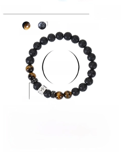 Detail view of 8mm tiger eye and lava stone beads bracelet with a zircon cross charm