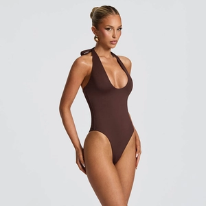 Detail of high-cut dark brown halter bodysuit with deep V-neck and ruched texture