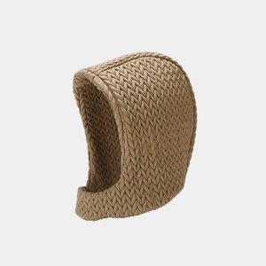 Detailed close-up of quilted beige balaclava texture and thick winter fabric insulation