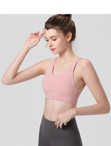 Detailed side view of pink sports bra with wide straps and high-elastic support fabric