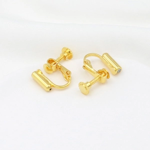 Macro view of 18K gold plated spiral earring converter with adjustable screw design