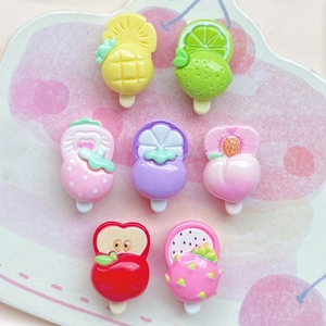 Assorted 7-piece set of colorful fruit-shaped resin popsicle charms on a cherry pattern plate