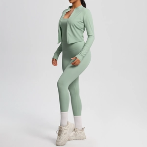 Three-piece yoga set showing side view of light green jacket, tank top and leggings