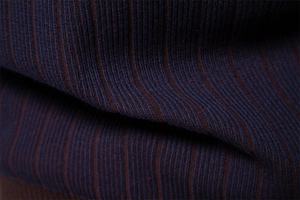 Macro view of blue and brown striped knit fabric texture on men's sweater