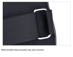 Detail view of durable black nylon strap and polished silver metal buckle on waist bag