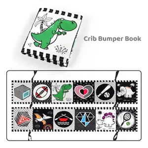 Macro view of high-contrast black and white baby cloth book with various sensory patterns