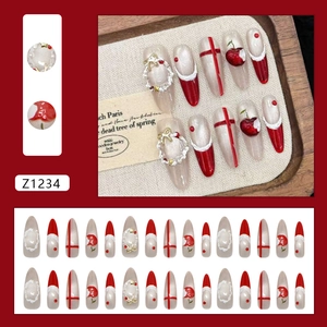 Christmas themed press-on nails with red cat eye effect and 3D floral accents