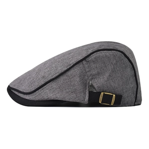 Gray cotton blend newsboy cap with black piping and adjustable bronze buckle