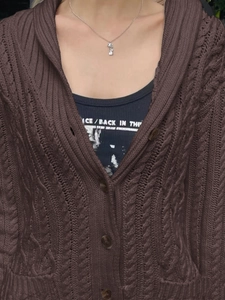 Brown cable knit cardigan with buttons and black printed tank top for women