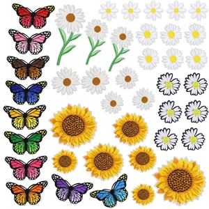 Close-up of colorful butterfly and floral embroidered patches with detailed needlework