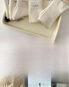 Detail of high-elasticity ribbed cuffs on milk-green Japanese style cotton crew socks