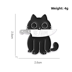 Detail of cartoon black cat enamel pin with HE HIM knife blade, size 2.9cm x 2.6cm
