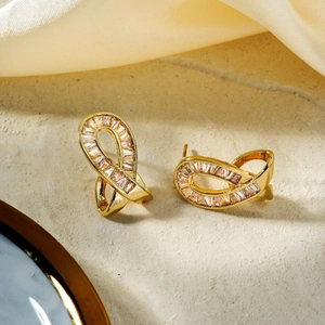 Golden twist infinity stud earrings for women with inlaid rectangular cubic zirconia
