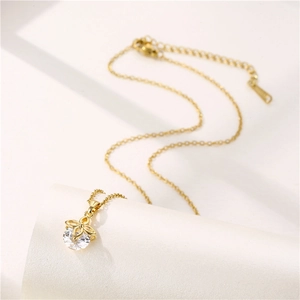 Gold stainless steel necklace featuring a floral pendant with a sparkling clear zircon stone