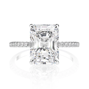 Macro shot of rectangular cut diamond with pavé setting on s925 silver ring band